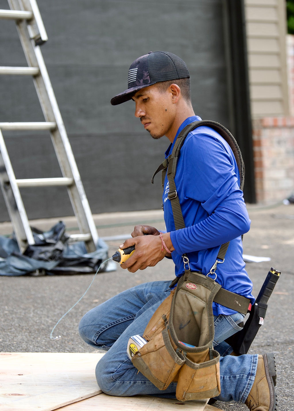 Spruce Up Northwest team member preparing for a roofing and siding project