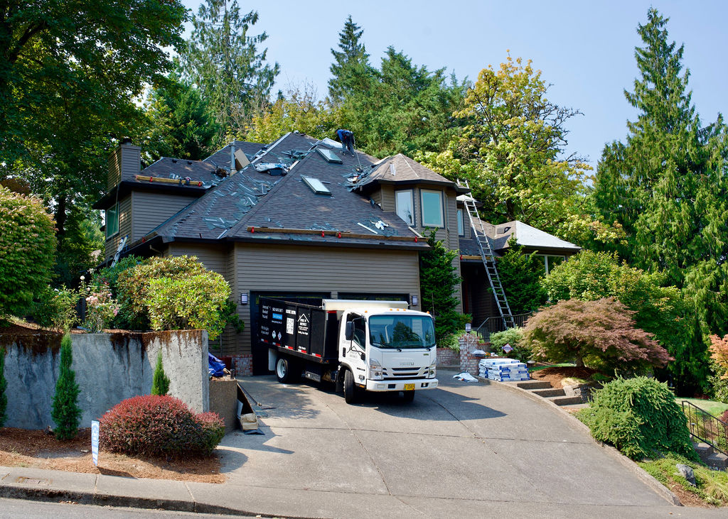 Spruce Up NW truck parked in front of home undergoing new roof install
