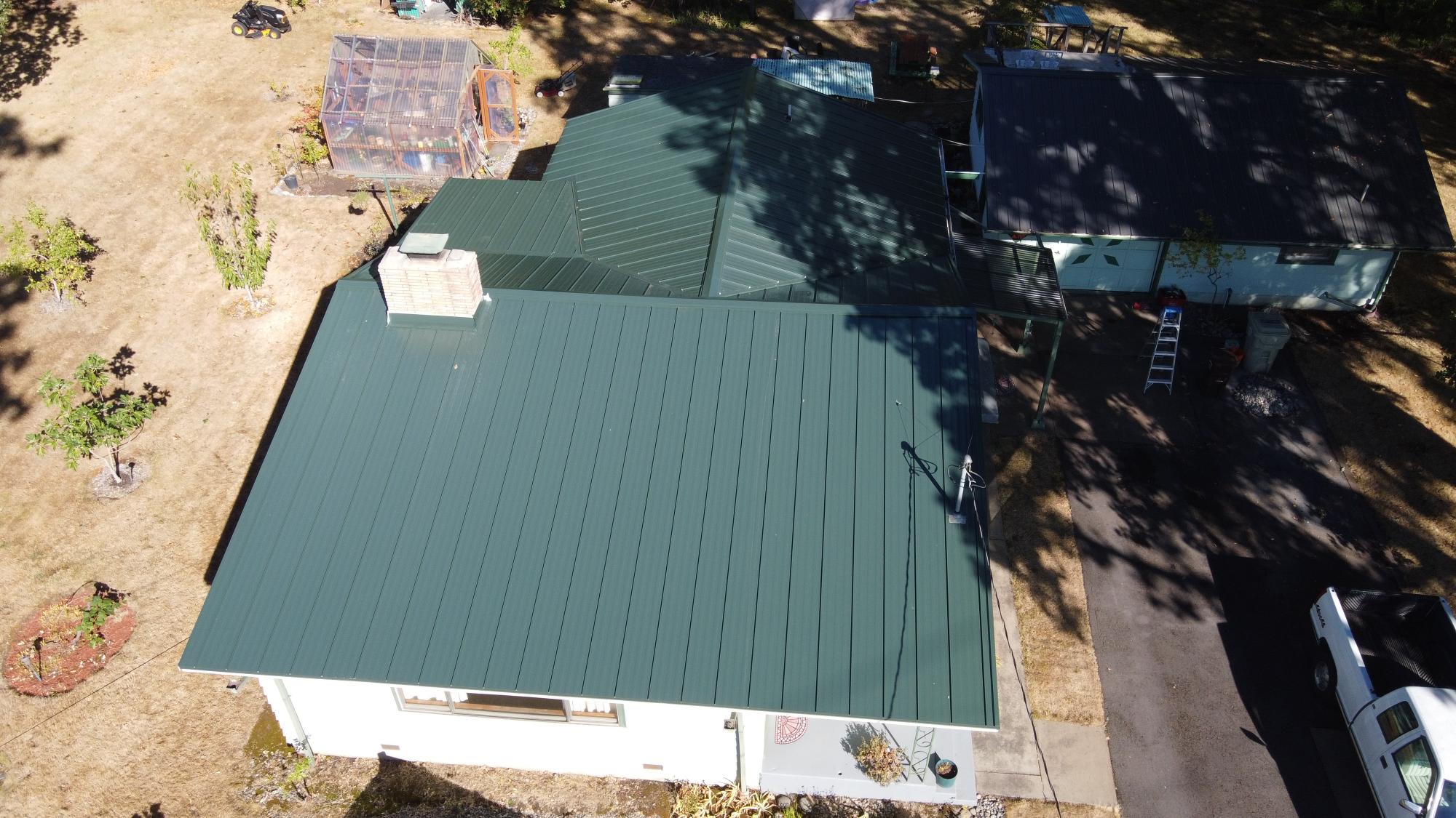 green standing seam metal roof project in Portland, OR