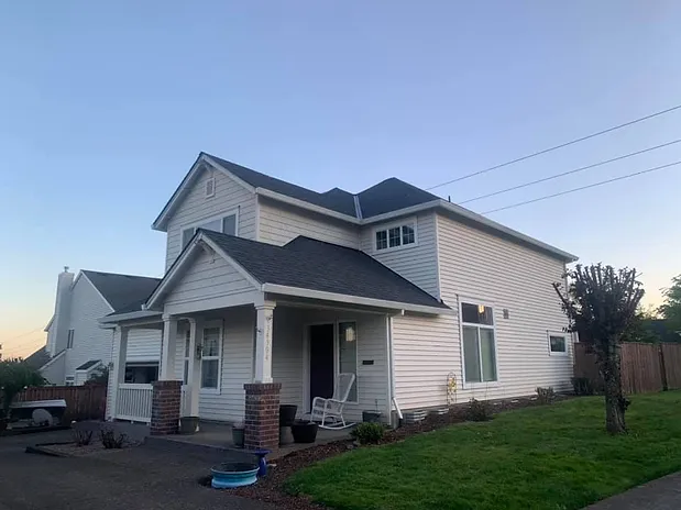 Spruce Up Northwest roof replacement project on two story white home in St. Helens, OR
