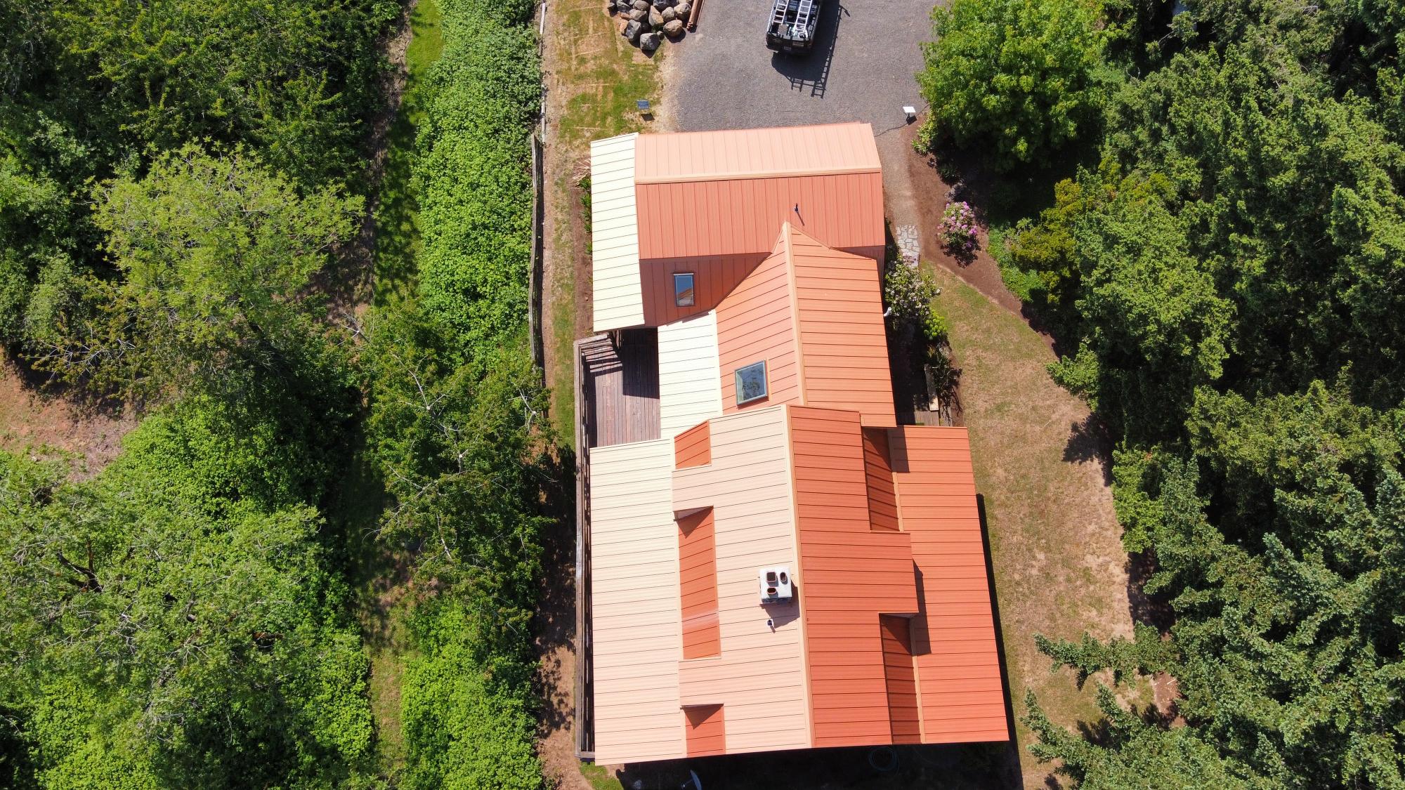 Aerial view of standing seam metal roof installation project in Portland, OR