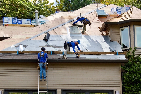 Spruce Up Northwest roofers tearing off old roof